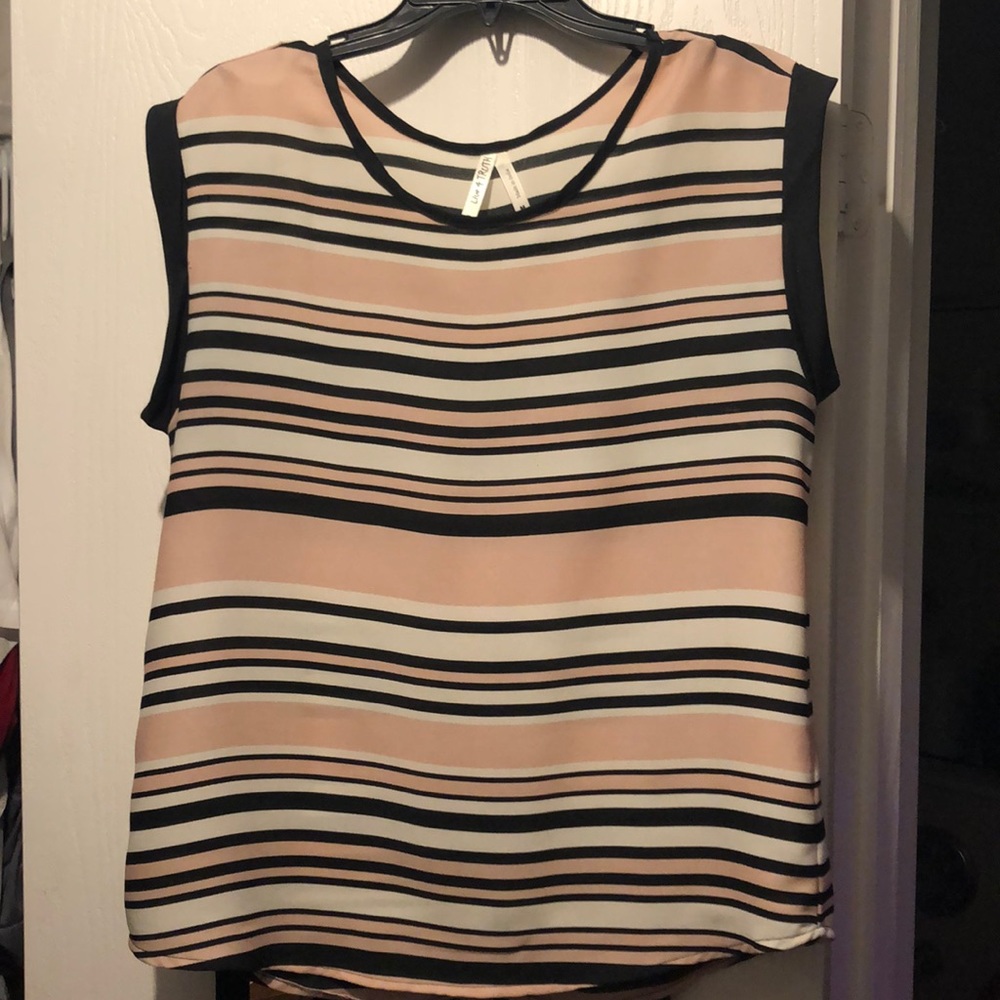 100% Polyester striped, short sleeve blouse.
